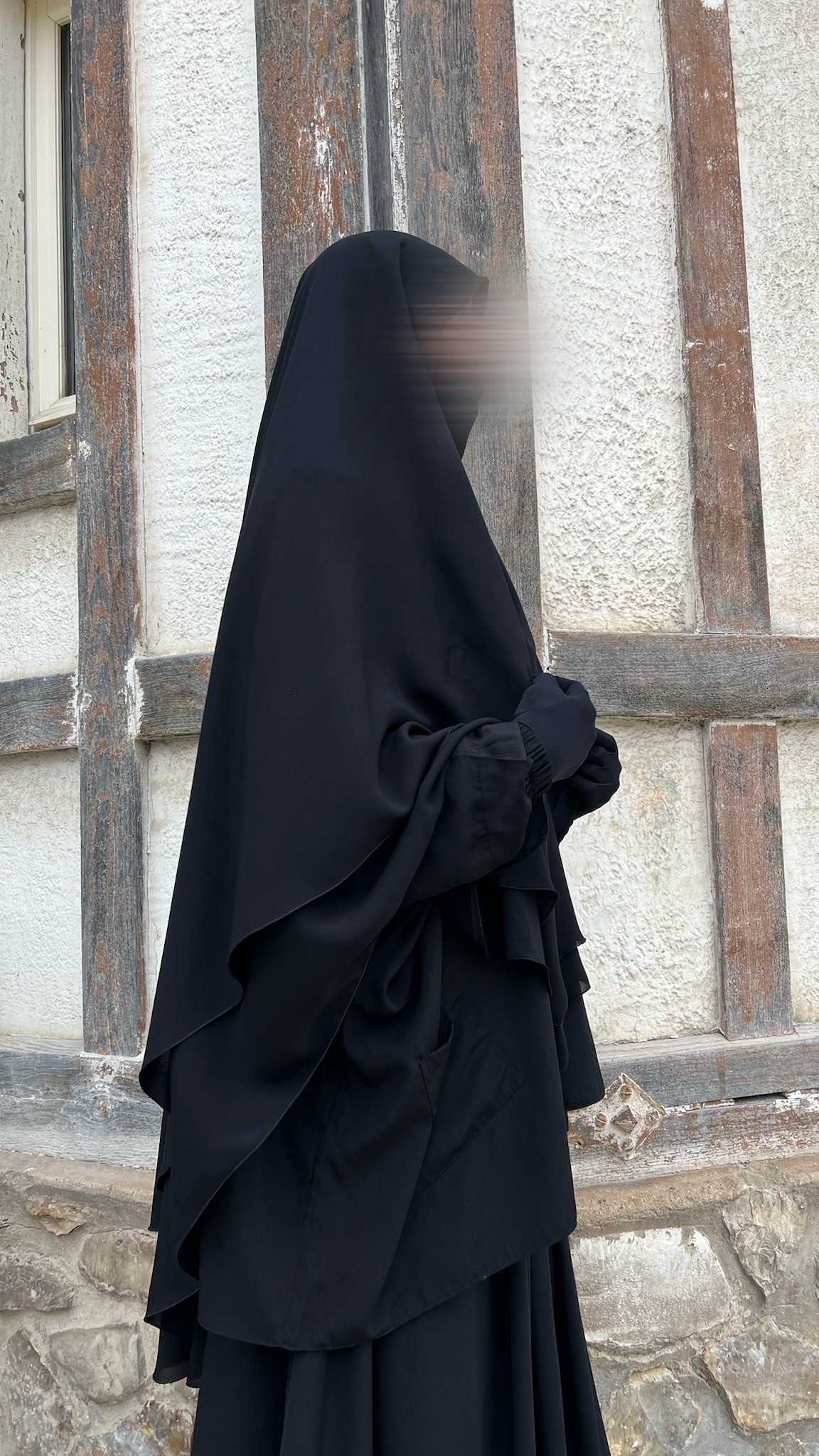 Tunique ample à poches noir, vue de profil, manches élastiques